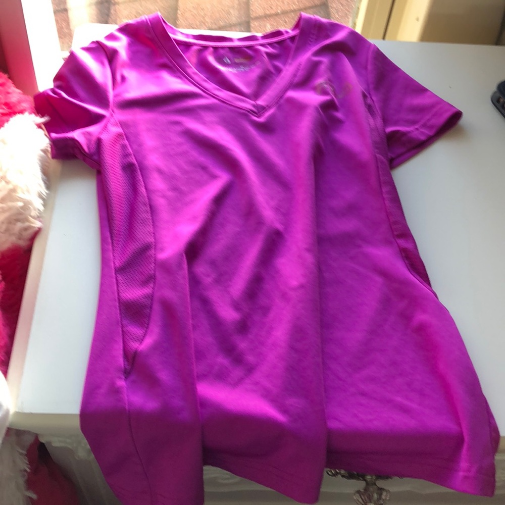 a purple t shirt it is tight size 8